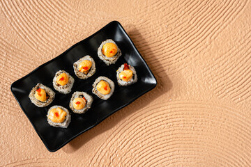 sushi is a Japanese dish of prepared vinegared rice, usually with some sugar and salt, accompanied by a variety of ingredients such as seafood, often raw and vegetables.