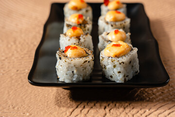 sushi is a Japanese dish of prepared vinegared rice, usually with some sugar and salt, accompanied by a variety of ingredients such as seafood, often raw and vegetables.