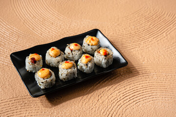 sushi is a Japanese dish of prepared vinegared rice, usually with some sugar and salt, accompanied by a variety of ingredients such as seafood, often raw and vegetables.