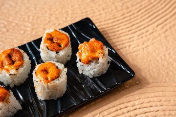 sushi is a Japanese dish of prepared vinegared rice, usually with some sugar and salt, accompanied by a variety of ingredients such as seafood, often raw and vegetables.