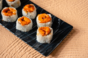 sushi is a Japanese dish of prepared vinegared rice, usually with some sugar and salt, accompanied by a variety of ingredients such as seafood, often raw and vegetables.