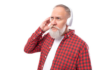 middle age business. 60s elderly man with gray beard and mustache with wireless headphones