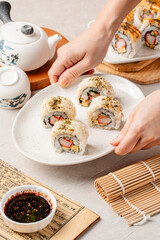 sushi is a Japanese dish of prepared vinegared rice, usually with some sugar and salt, accompanied by a variety of ingredients such as seafood, often raw and vegetables.