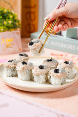 sushi is a Japanese dish of prepared vinegared rice, usually with some sugar and salt, accompanied by a variety of ingredients such as seafood, often raw and vegetables.