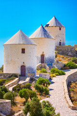 Fototapeta na wymiar Picturesque windmills and castle of Panteli in Leros island, Greece