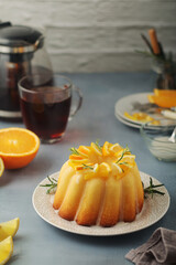 A sweet citrus cake served with oranges and lemons