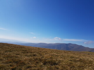 view from the top of the mountain to the mountainous landscape of the Ukrainian Carpathians