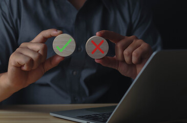 Businessmen think and choose between right and wrong symbols. True and False symbols accept...
