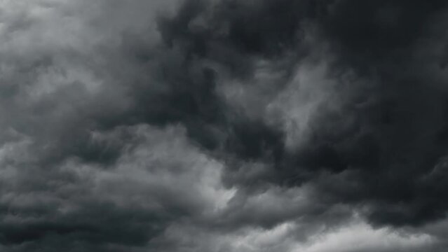 storm sky timelapse, dark dramatic clouds during thunderstorm, rain and wind, extreme weather, abstract background
