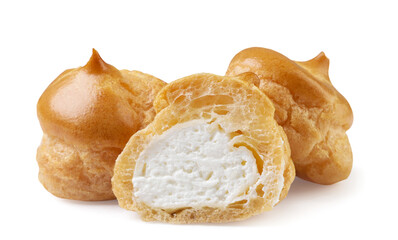 Profiteroles and half close-up on a white. Isolated