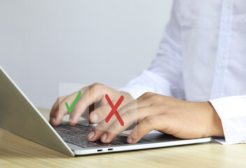 Businessmen think and choose between right and wrong symbols. True and False symbols accept...