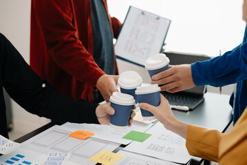  UX developer and ui designer brainstorming about mobile app interface wireframe design with...