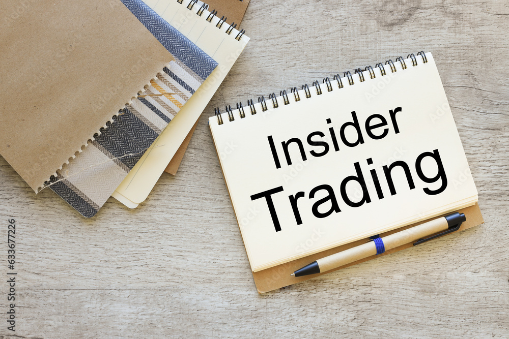 Poster open notebook with text near notebooks insider trading
