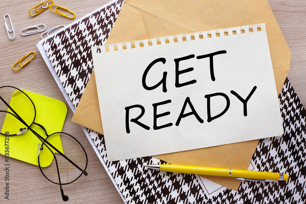 Poster notebook with get ready word with office tools on pink table. business conceptual