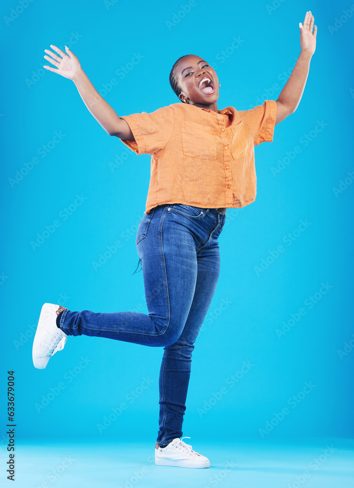 Wall mural winner, excited or portrait of black woman jump on blue background with energy, joy or smile in stud