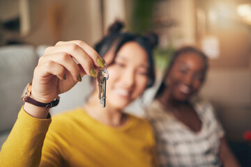Hand, keys and new home or people moving in together for real estate investment. Rent, mortgage and...