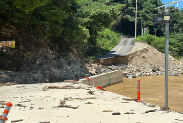 Heavy rain has swept away road and bridge by typhoon Khanun
