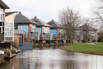 Residential area with modern architecture along the water in the Kattenbroek district in the Dutch city of Amersfoort.