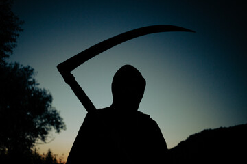 grim reaper, the death itself, scary horror shot of Grim Reaper holding scythe