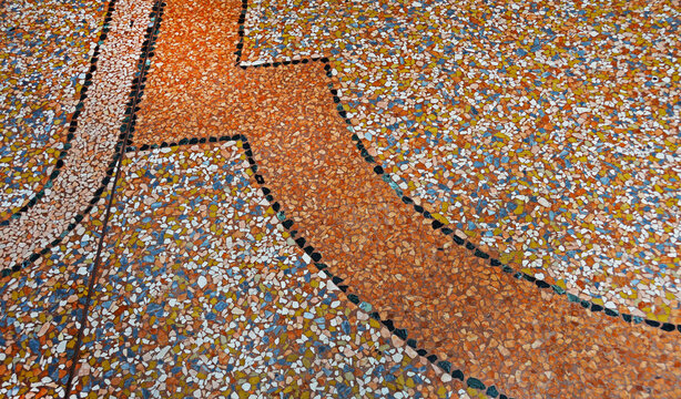 A fragment of the sidewalk on Ugo Bassi Street in Bologna, Italy