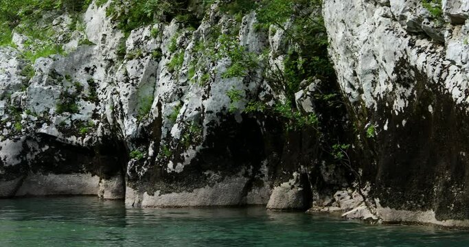 moss-covered rocky banks of a mountain river. High quality 4k footage