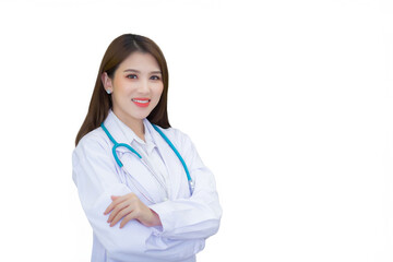 Fototapeta premium Professional young Asian woman doctor wearing white robe and stethoscope standing with arms crossed happy and smile at examination room in hospital while isolated on white background.