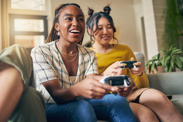 Friends, women and gaming on tv in home living room on sofa, smile and having fun online. Television, girls and play video game on couch, esports competition and bonding to relax in house together - Powered by Adobe
