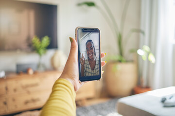 Phone, wave and black woman on video call in portrait, communication and conversation. Smartphone hand, hello and happy person in webinar, virtual and online meeting, face and pov discussion in house