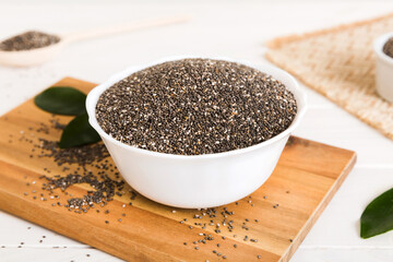 Chia seeds in bowl on colored background. Healthy Salvia hispanica in small bowl. Healthy superfood