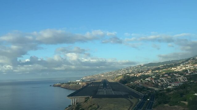 Landing at Funchal airport, Madeira island ( Portugal). An awesome pilot&rsquo;s real time perspective just after dawn.