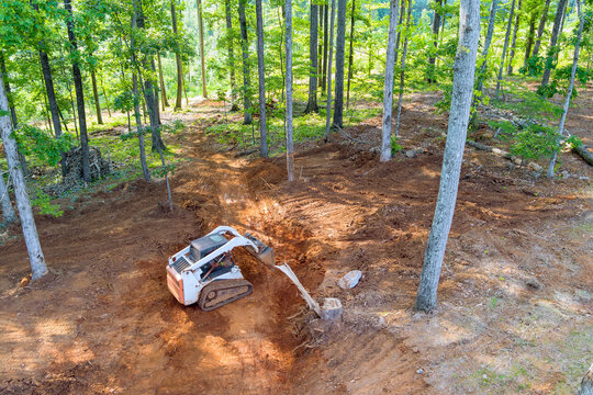 It is common practice to use tractor to move earth when preparing an area for construction