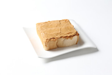 square peanut butter jam toast bread set with half boiled soft chicken egg and hot coffee or tea...