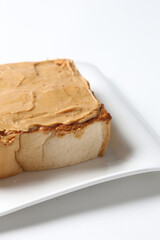 square peanut butter jam toast bread set with half boiled soft chicken egg and hot coffee or tea breakfast on white background asian chef appetiser halal bakery food restaurant pastry menu for cafe