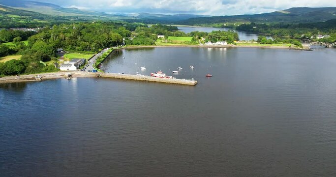 An aerial forward 4K shot of Kenmare Harbour  Marina Co Kerry Ireland looking towards the North East