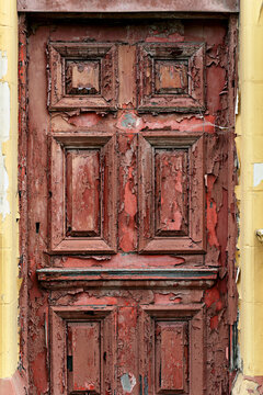 Large Wooden Front Door Very Old With Peeling Red Paint And Decaying Wood