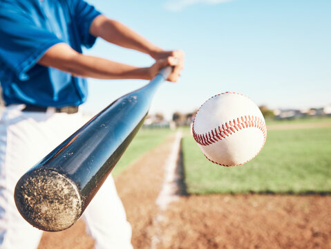 Baseball, hit and person on field for in closeup training, sports and fitness in outdoor competition. Hands, ball and bat softball player with power strike at stadium for action, speed or performance