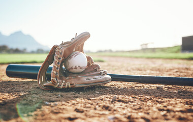 Glove, bat and baseball gear on a field for a game, professional competition or sports. Ground,...