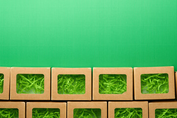 Green Friday backgrounds mock up. Sale Tag on green background. Paper shopping boxes and green tag. Environmentally friendly shopping idea, useful things on sale. Reducing excessive consumption.