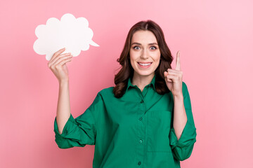 Photo of funky excited lady wear green shirt rising mind cloud empty space pointing finger isolated pink color background