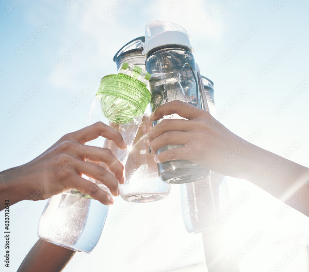 Sticker Hands, water bottle and toast to fitness together after workout, exercise or training outdoor with team of players. Sport, goals and cheers with group and liquid for hydration, celebration and unity