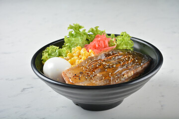 japanese bbq grill teriyaki salmon seafood with boiled onsen egg, corn, red ginger and rice in black bowl on wood tray white marble table background chef cook healthy poke bowl halal food menu