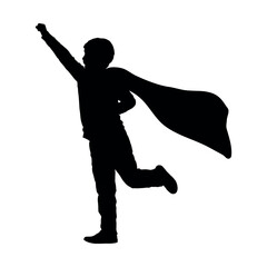 Little boy imitate superhero playing a rule of superman silhouette.