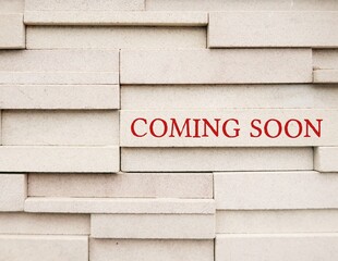 Wall with text COMING SOON, to inform something imteresting will be arriving in the near future