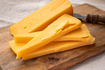 Cheese collection, piece of matured British yellow cheddar cheese made in Somerset from cow milk