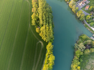 Panoramic aerial view on green premier cru champagne vineyards and fields near village Hautvillers...