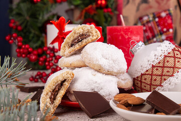 Traditional Christmas cookies biscuits snowballs covered icing sugar powder with almond nut stuffed  nutella chocolate. 