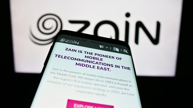 Stuttgart, Germany - 08-05-2023: Mobile phone with website of Mobile Telecommunications Company KSCP (Zain) on screen in front of logo. Focus on top-left of phone display.