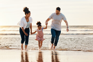 Family, running and ocean, beach and sunset, happiness and fun together with games and bonding on vacation. Travel, adventure and playful, parents and child, happy people in nature and holding hands - Powered by Adobe