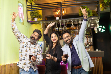 Indian people dancing at restaurant and enjoying party