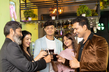Indian people enjoying party at restaurant.